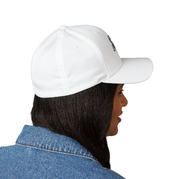Person wearing a white cap and denim jacket on a white background
