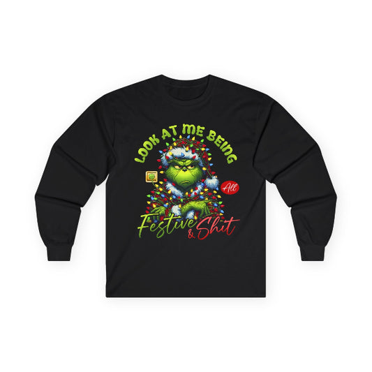 Black long-sleeve shirt with a festive design featuring a character wrapped in lights on a white background.