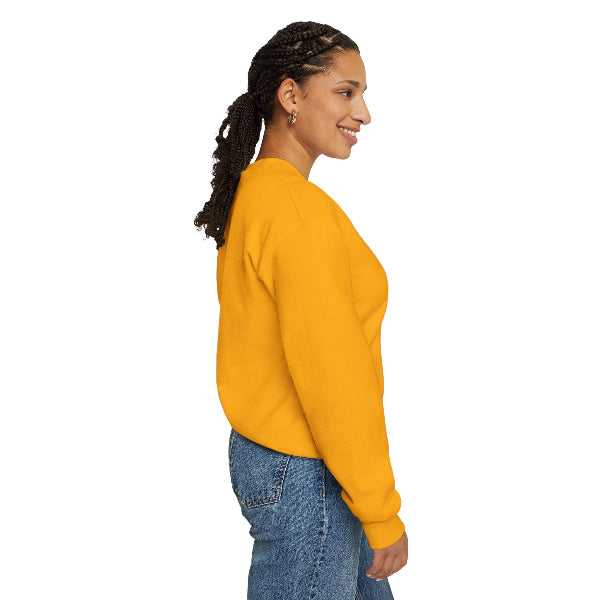 Woman wearing a yellow sweatshirt and blue jeans on a white background