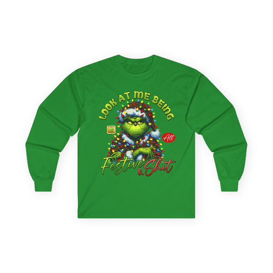 Green long-sleeve shirt with festive graphic design on a white background