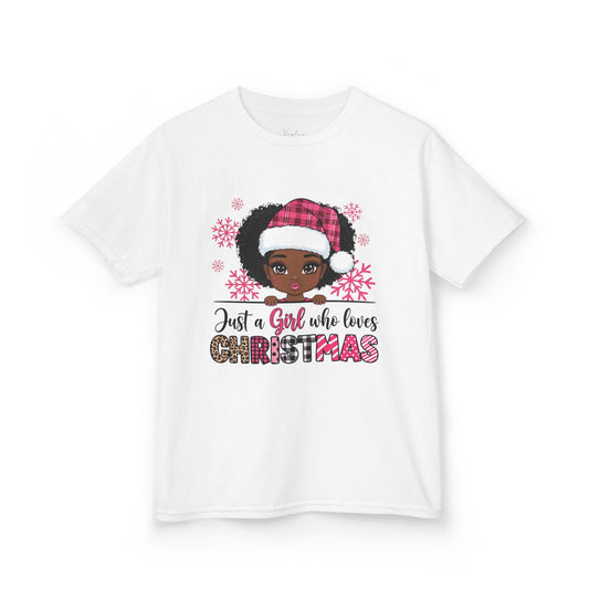 White t-shirt with a graphic of a girl wearing a Santa hat and text 'Just a Girl who loves Christmas' on a white background.