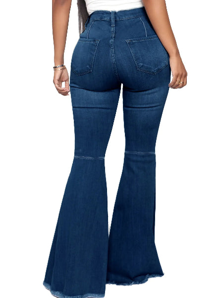 Blue flared jeans worn by a person on a white background