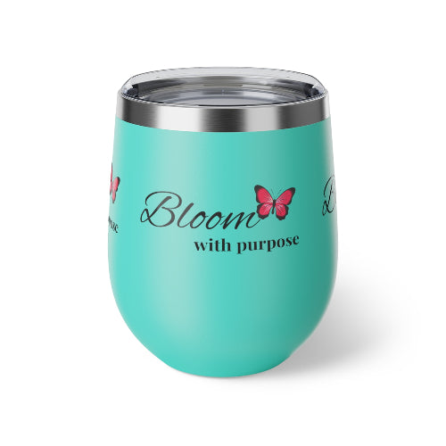 Turquoise tumbler with 'Bloom with purpose' text and butterfly graphic on a white background