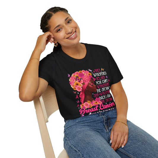 Woman wearing a black t-shirt with a colorful design and text, sitting on a chair.