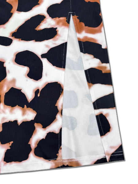 Leopard print fabric with a clear ruler for scale on a white background