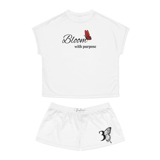 White t-shirt and shorts set with 'Bloom with Purpose' text and butterfly design on a white background